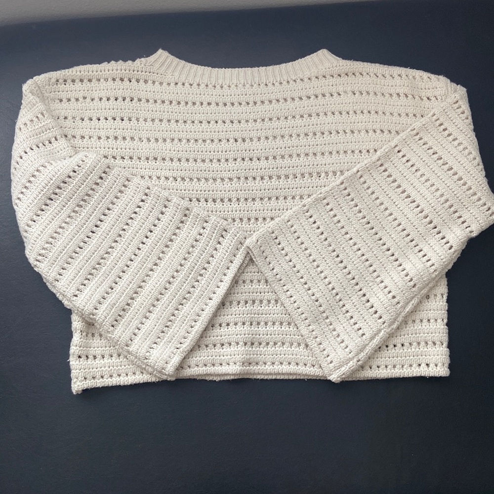 Cropped cotton sweater with open stitched pattern and bell sleeves
